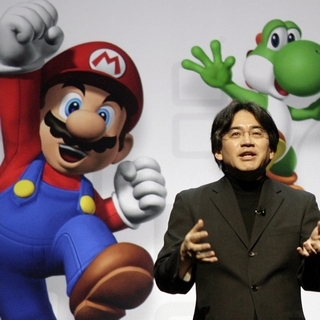 Mario with Yoshi and Satoru Iwata