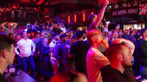 England fans celebrate the final whistle after Watkins seals 2-1 semi final win over Holland