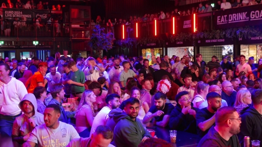 England fans celebrate Kane's equalising penalty against Holland